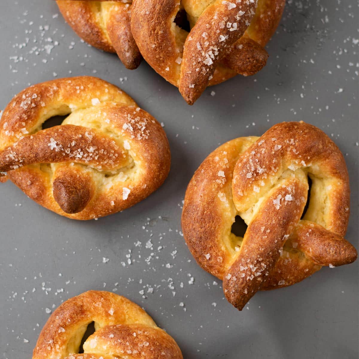 Low-Carb Keto soft pretzels on a tray with text saying Soft and delicious, free recipe.
