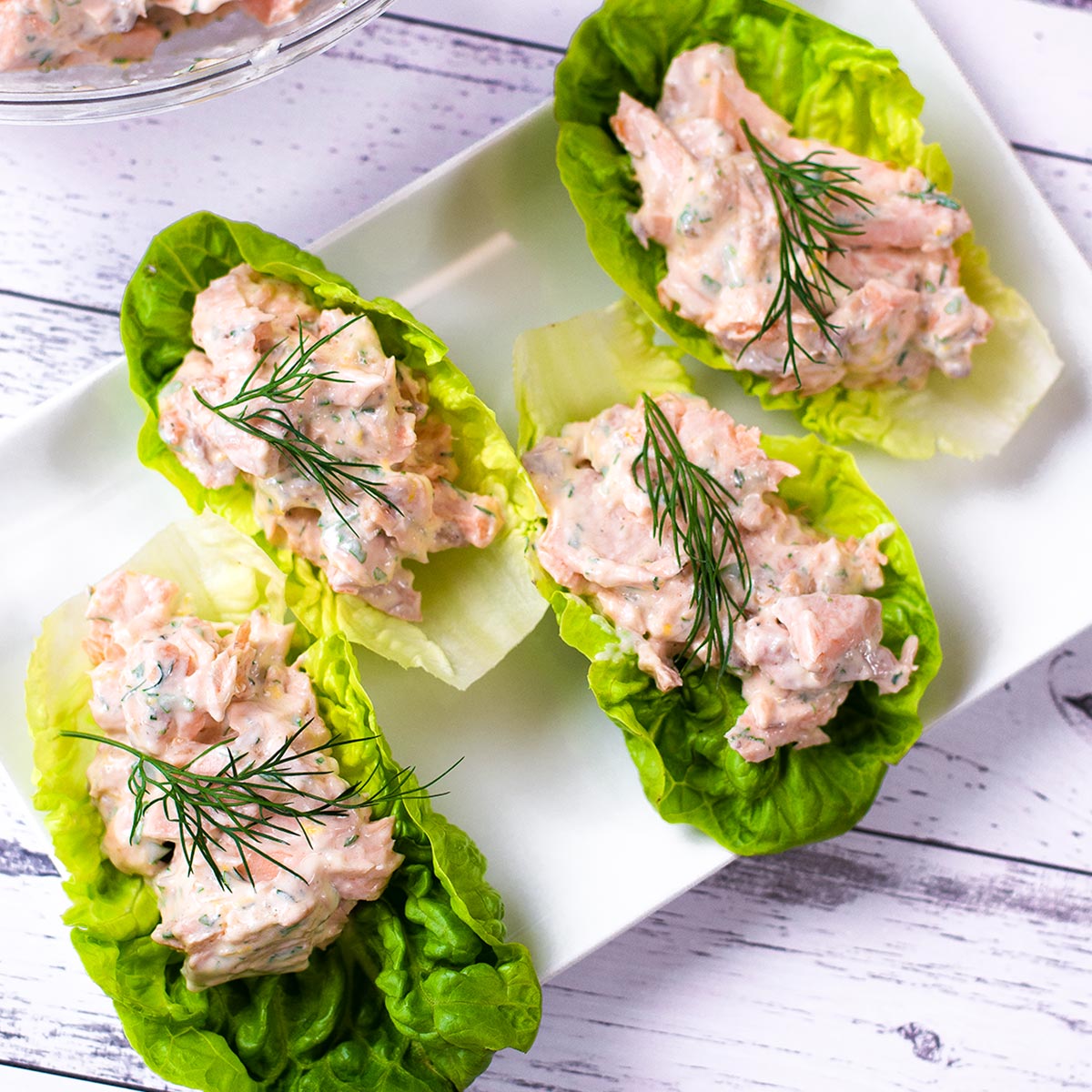 Salmon lettuce wraps on a plate.